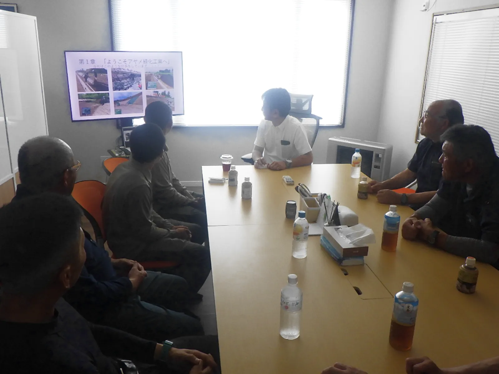 AYAME's president welcoming the new team members with a presentation
