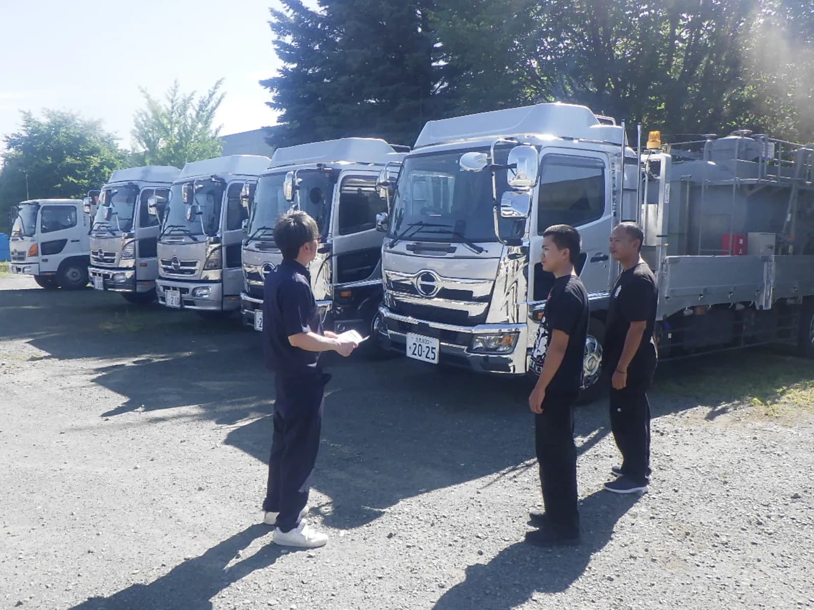 New team members learning about AYAME's specially equipped work truck